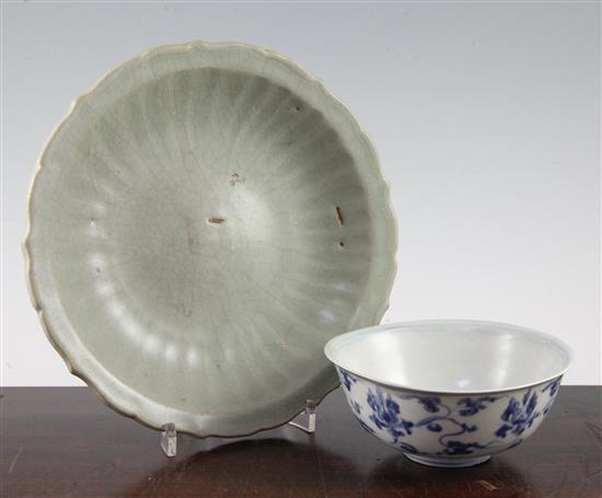 A Chinese Longquan celadon dish and a Ming dynasty lotus bowl, 15th / 16th century, diam. 15cm